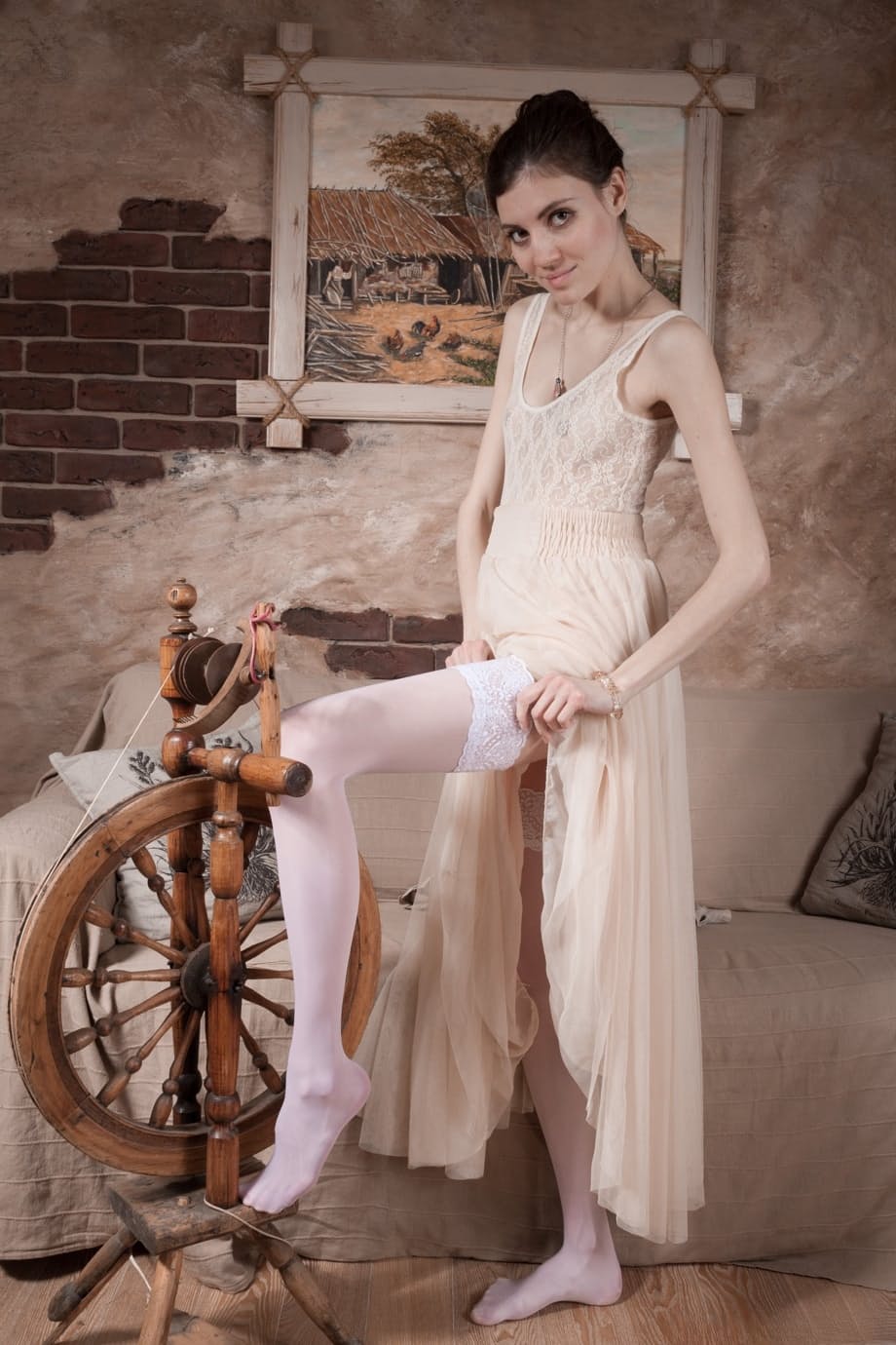 Pale girl removes a white dress before showing her hairy armpits and pussy