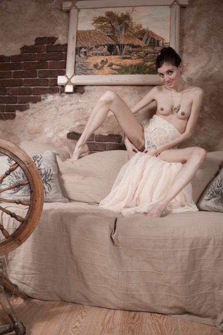 Pale girl removes a white dress before showing her hairy armpits and pussy
