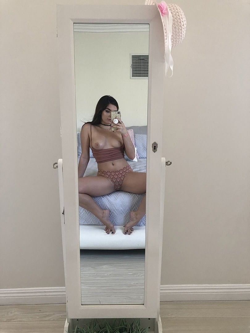 Delightful short brunette Keira Croft spreading her cheeks in a hotel room